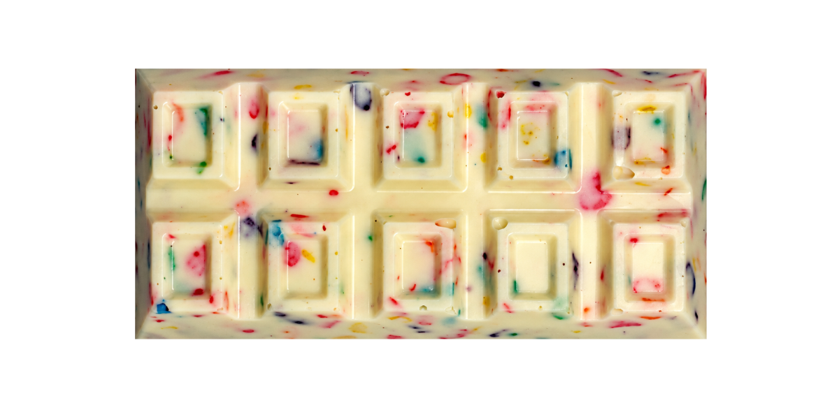 Fruity Pebble Cereal Milk chocolate bar stuffed with marshmallow cream, vanilla cake & lucky charms